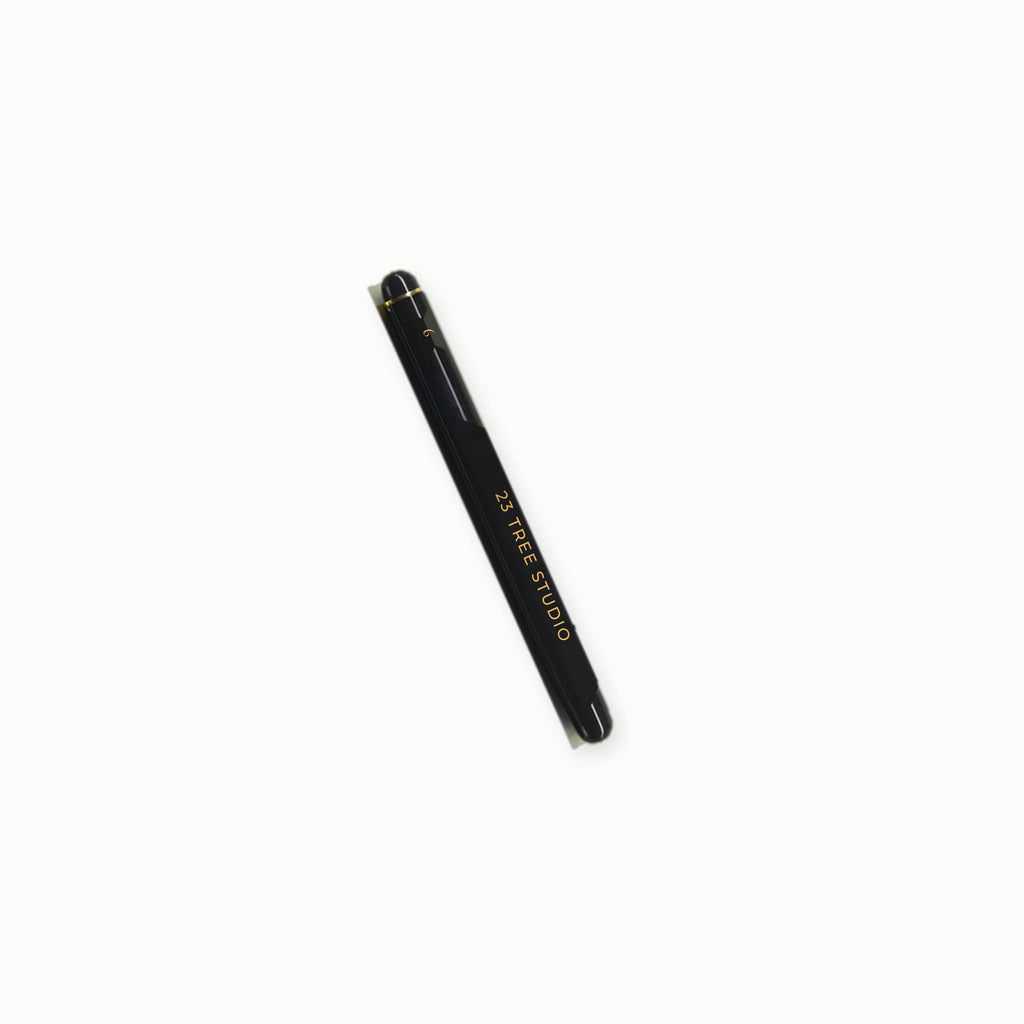 Travel brush with protective cap